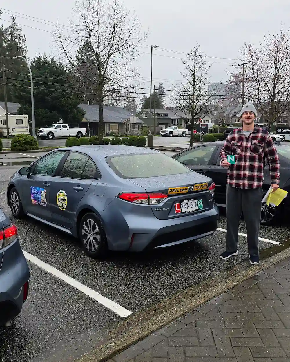 Tomas Hardy standing with his N sign beside the Right of Way training car